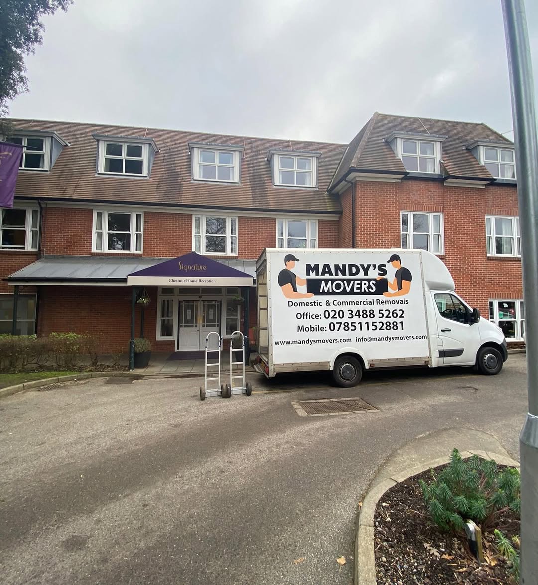 2 mandys movers vans outside house for house move